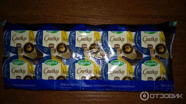 Сливки порционные Campina 10% фото