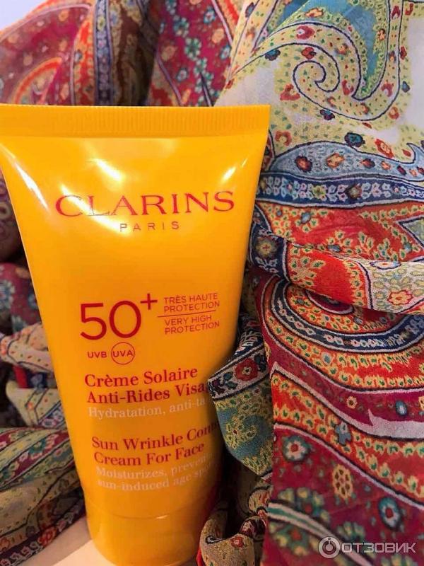 Clarins spf 50 для лица. Солнцезащитный крем Sun Control SPF 50. Кларанс солнцезащитный крем. Солнцезащитный крем в оранжевой упаковке для лица. Тайский солнцезащитный крем.